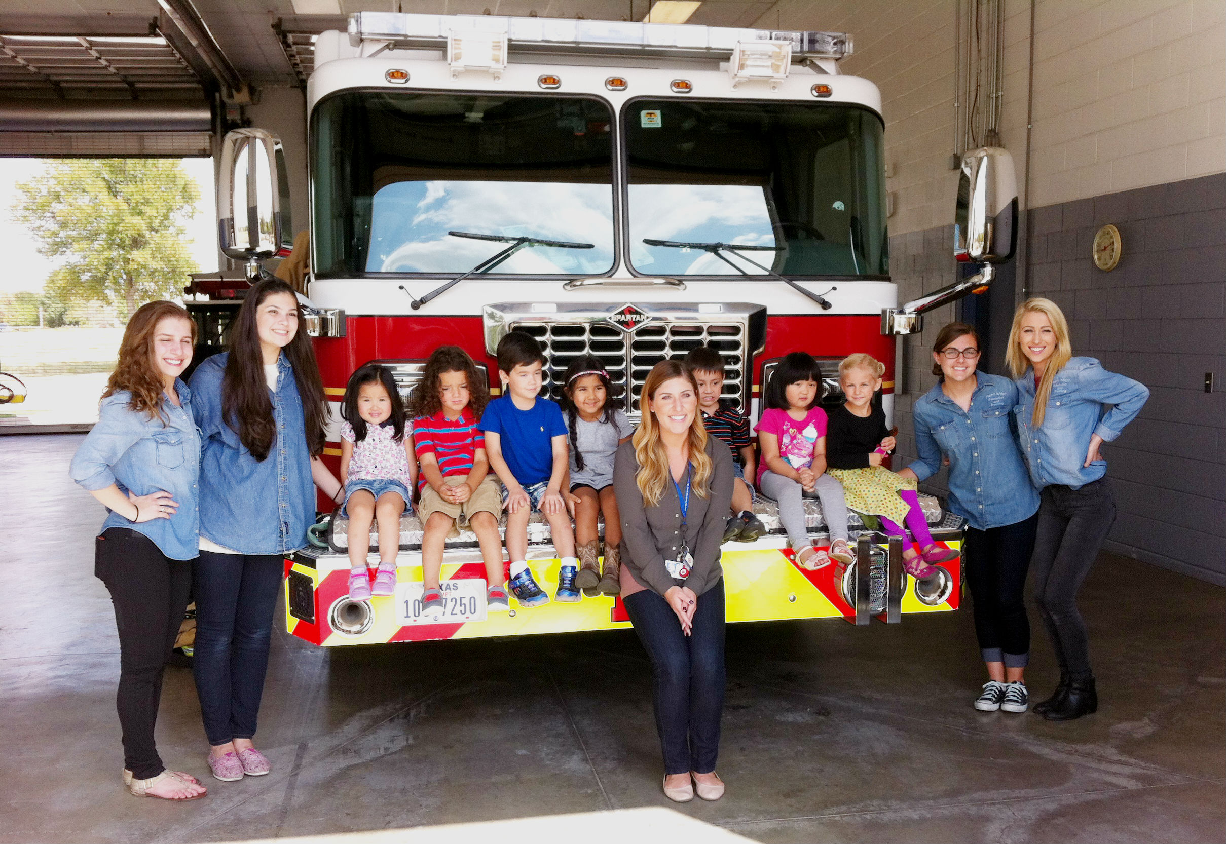 Preschool students and teachers visiting fire station 
